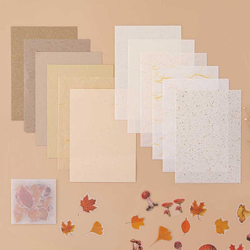 Tsuki Mixed Scrapbook Paper Pack with free stickers on beige background